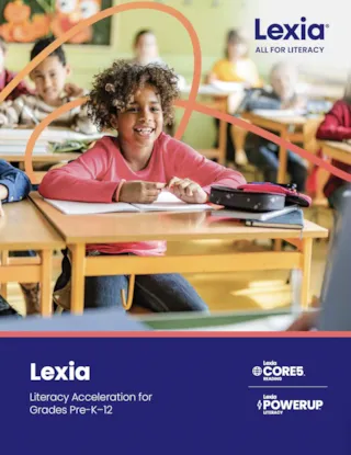 A child smiles while writing at a classroom desk. The text reads, Lexia: Literacy Acceleration for Grades Pre-K–12.