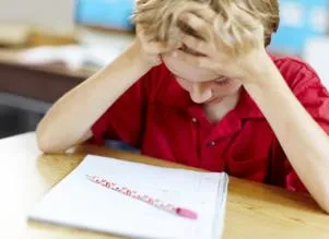 frustrated young boy in class
