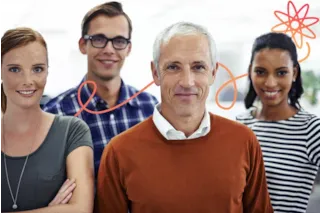 Four smiling people stand together indoors, with an orange atomic doodle graphic in the background.