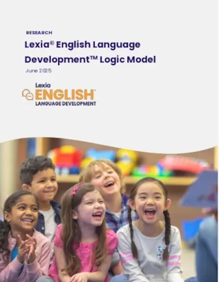 Five young children sit together indoors, smiling and laughing in a colorful classroom setting.