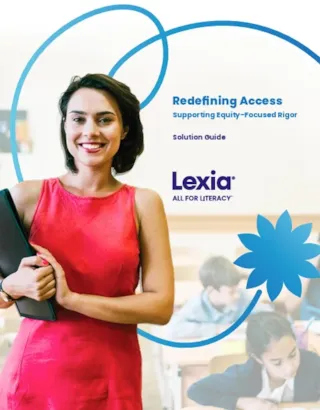 Smiling woman holding folder stands in front of students in a classroom; text reads “Redefining Access” by Lexia.