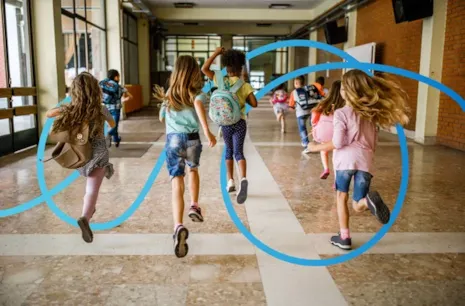 Children with backpacks run down a school hallway; blue swirls are drawn over the image.