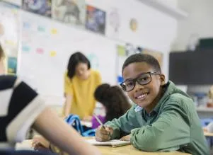elementary-age african american boy with glasses