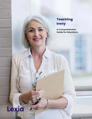 Elderly woman with glasses and a clipboard smiling, standing against a wall, near a window. Text: Teaching Irony and Lexia.