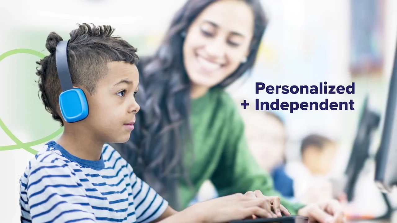 Young boy wearing blue headphones uses a computer, with a smiling woman and Personalized + Independent text beside him.