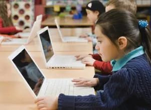 elementary school kids on laptops