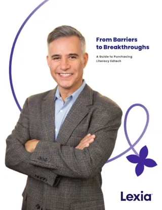 Man in a suit smiling, with arms crossed, next to text: From Barriers to Breakthroughs: A Guide to Purchasing Literacy Edtech.