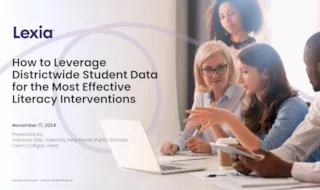 Group discussion with a presentation slide titled How to Leverage Districtwide Student Data for Literacy Interventions.