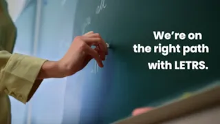 A hand writes on a chalkboard next to the text, “We’re on the right path with LETRS.”.