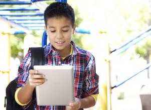 middle-school boy with iPad