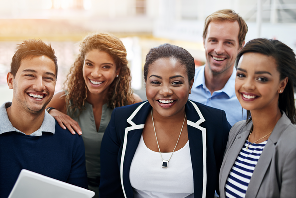 A smiling group of professionally dressed educators